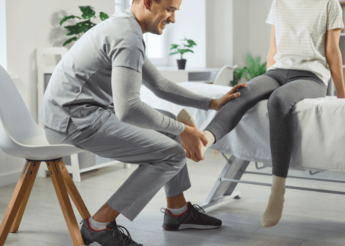 Rehabilitation after injury, leg massage for female patient