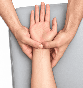 Carpal tunnel compression test applying pressure over the median nerve at the wrist